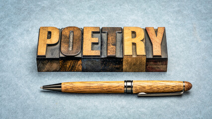 poetry word abstract - text in vintage  letterpress wood type with a stylish pen against textured paper - obrazy, fototapety, plakaty