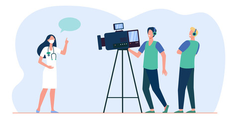 Cameramen taking video of medical expert