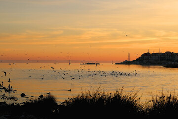 Naklejka premium Beautiful sunset over the sea in Stobrec, small town near Split, Croatia.