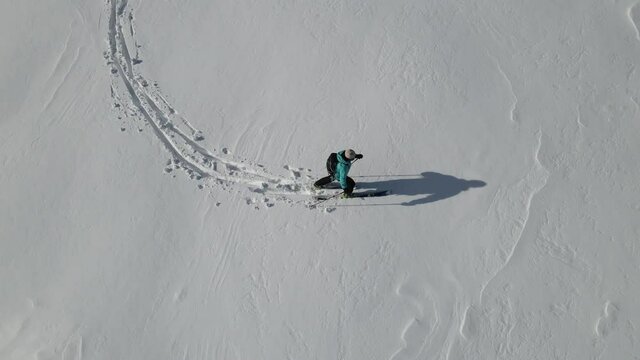 Ski touring adventure in Beskidy Mountains, Poland. Man backcountry skiing in fresh powder snow.