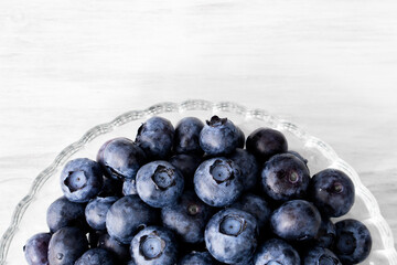 Hand hold Harvest summer jam ingredient organic bio tasty blueberry healthy natural purple fruit berry for sweet dessert vitamin antioxidant snack with fresh wet water drop