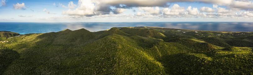 Aerial view above scenery of Curacao, Caribbean with ocean, coast, hills, lake