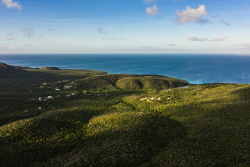 Fototapeta na wymiar Aerial view above scenery of Curacao, Caribbean with ocean, coast, hills, lake