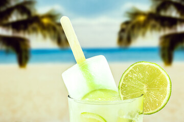 lemon drink with popsicle, beach in the background. Drink known as caipirinha in brazil, ice cream with alcohol and lemon