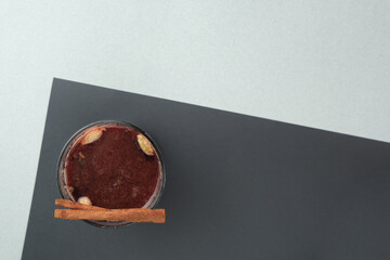 Delicious mulled wine on a black table, flat lay. Place for text
