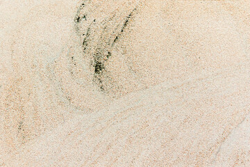 Apply sand rubbing plaster to masonry on concrete. Scratched and cracked dirty weathered sand textured plaster surface texture.