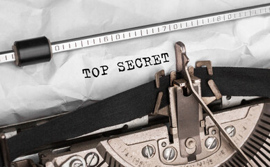 Text Top Secret typed on retro typewriter