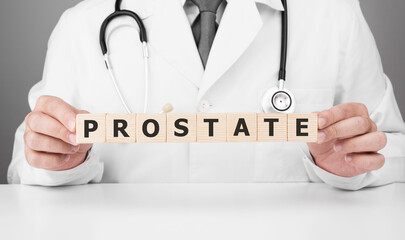 Doctor holds wooden cubes in his hands with text Prostate