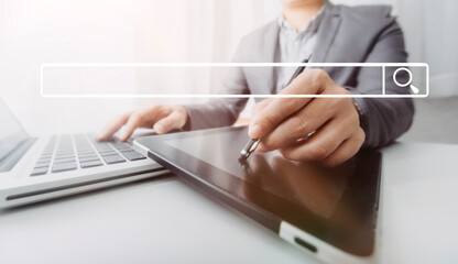 Searching Browsing Internet Data Information with blank search bar.businessman working with smart phone, tablet and laptop computer on desk in office. Networking Concept