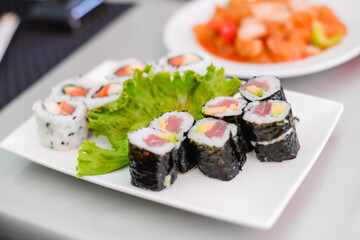 Sushi rolls set. set of sushi over white plate. Food at chinese buffet restaurant