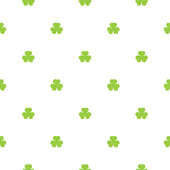 Seamless shamrock background with green clover leaves on white background.