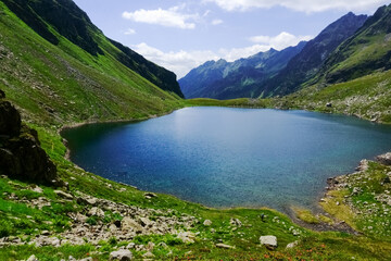 deep blue cold water from a mountain lake view from above