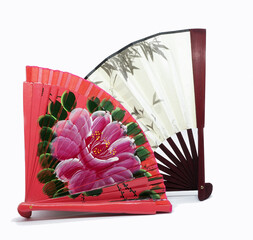 Two beautiful red spanish fan with flower pattern and traditional japanese fan with bvmbuka pattern