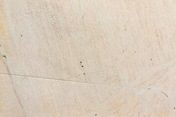 Apply sand rubbing plaster to masonry on concrete. Clean sand textured plaster surface texture.