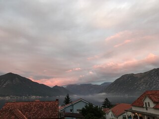 Sunrise in the Kotor Bay. Village in the mountains