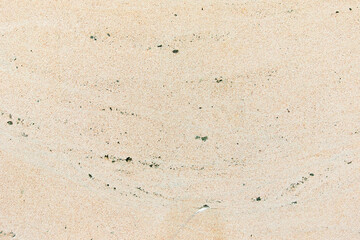 Apply sand rubbing plaster to masonry on concrete. Clean sand textured plaster surface texture.