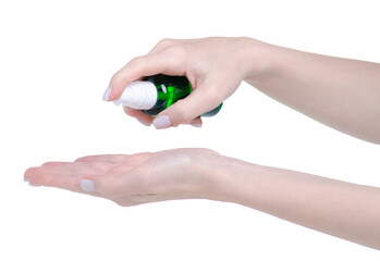 Green cosmetic bottle with dispenser in hand on white background isolation