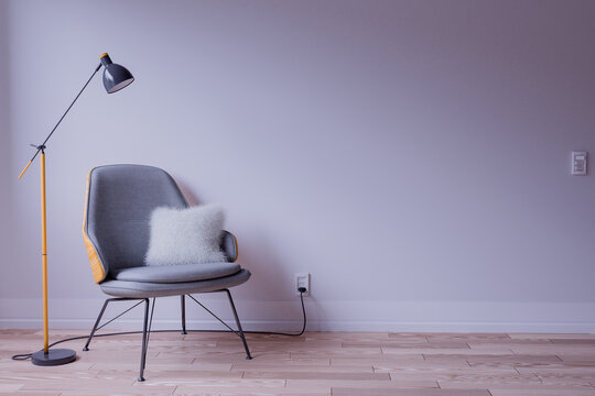 Designer Chair And Lamp On An Empty Room