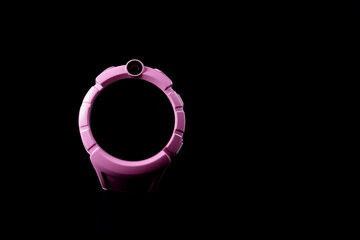 Pink children's smart watch. Isolated on black smart watch.