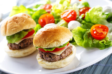 Mini Burgers with Side Salad. High quality photo.