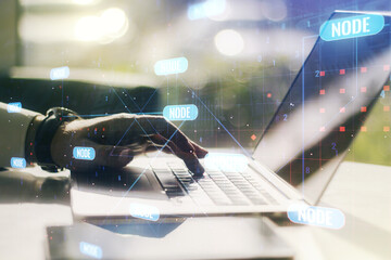 Multi exposure of abstract creative coding sketch and hands typing on computer keyboard on...