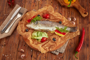 Steamed sea bass fish with fresh vegetables, vegetarian food