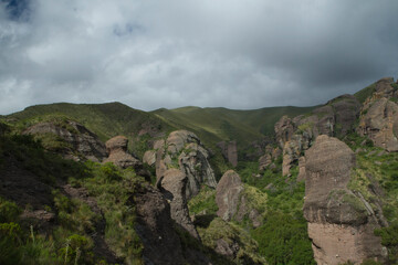 Fototapeta na wymiar Alpine landscape. Panorama view of the mountains, green forest and rock formations called Los Terrones, in Cordoba, Argentina.