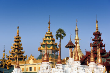 Naklejka premium detail view to a group of golden stupas at the Shwedagon Pagoda in Yangoon, Myanmar (Burma)