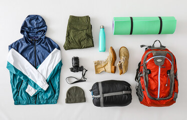 Equipment for hiking on light background