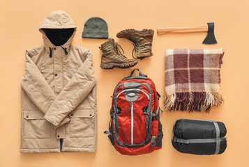 Equipment for hiking on color background © Pixel-Shot