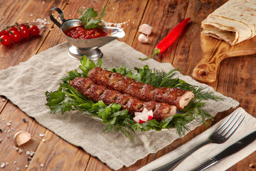 Kebab grill BBQ, wood background