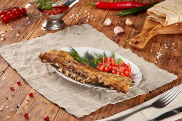 Grilled lamb ribs BBQ, wood background