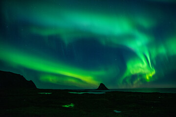 strong northern lights (aurora borealis) in the norwegian wilderness