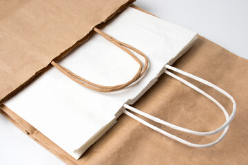 Eco-friendly paper bags for packaging food in supermarkets. shopping bag. Let's save the planet....