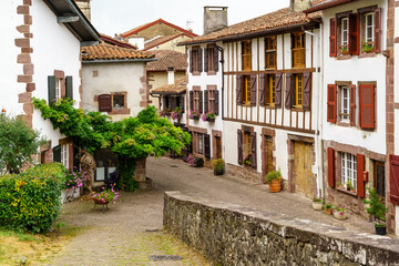 Fototapeta na wymiar Streets, houses and typical architecture of the village San Juan Pie de Puerto in the French Basque country. 