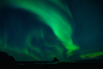 strong northern lights (aurora borealis) in the norwegian wilderness