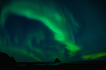 strong northern lights (aurora borealis) in the norwegian wilderness