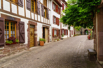 Fototapeta na wymiar Streets, houses and typical architecture of the village San Juan Pie de Puerto in the French Basque country. 