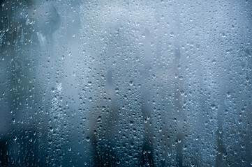 Rainy background, rain water drops on the window or in shower stall, autumn season backdrop,...