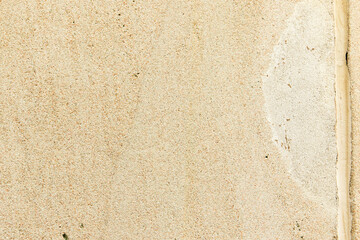 Apply sand rubbing plaster to masonry on concrete. Clean sand textured plaster surface texture.