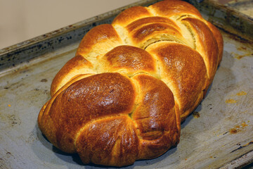 A braided challah brioche bread