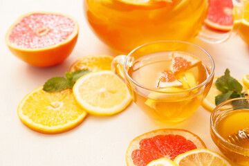 Cup of hot healthy beverage on white background