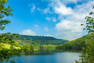 Rursee at Eifel National Park, Germany. Scenic view of lake Rursee and surrounded green hills in North Rhine-Westphalia