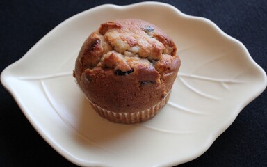 A blueberry muffin on a plate