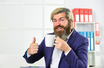 Enjoyment. Tea time. You have to trust your instincts. Relax and keep calm. Drink coffee. Bearded man drinking hot beverage. Breakfast tea. Morning beverage. Businessman drink coffee in office
