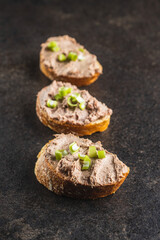 Liver pate on sliced baguette.
