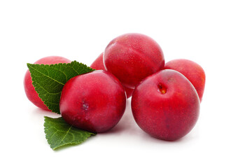 Blue plums with leaves.