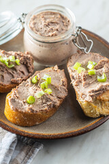 Liver pate on sliced baguette.