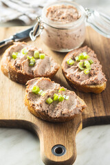Liver pate on sliced baguette.