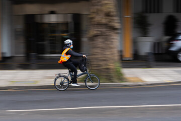 Cyclist on a bike with a reflective vest